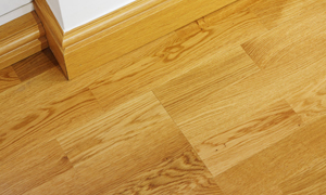 Wooden style laminated flooring, with wooden skirting boards